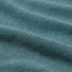 Side view of the Mooncastle Crew Neck Mist Green showing sleeve shape, side seams, and natural knit drape.