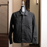 Front view of the Nanamica Short Denim Jacket in black featuring a clean cropped silhouette and structured design.
