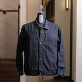 Front view of the Nanamica Short Denim Jacket in indigo featuring a cropped silhouette and clean structured design.
