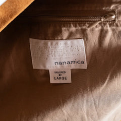 Close-up of the Nanamica interior label and inner lining construction.