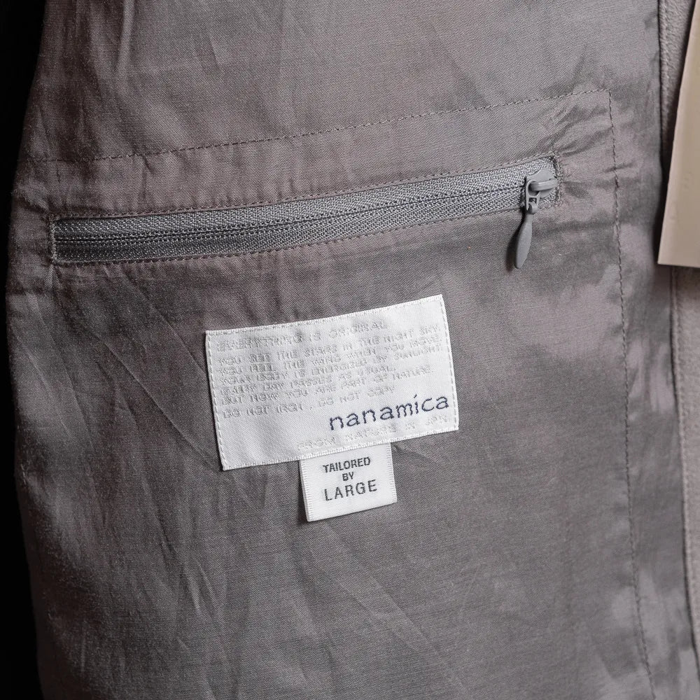 Close-up of the interior zip pocket showing functional storage and inner construction detail.