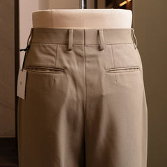 Back view highlighting welt back pockets and balanced silhouette.