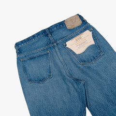 Close-up of the back pocket showing stitching, pocket shape, and natural two-year wear.