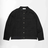 Front view of the Refinement Knitwear Essential Trucker Jacket Black showing the structured knit trucker silhouette and deep black tone.