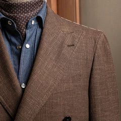 Close-up of the peak lapel on the RMJ-04 Dark Brown Jacket showing the lapel roll, hand-finished edges, and luxurious Zegna wool texture.