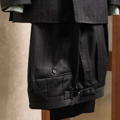 Front view of the trousers from the RMJ-04 Chalk Stripe Charcoal Grey Suit showing pleats, tailored leg shape, and the refined Zegna Electa chalk stripe fabric.