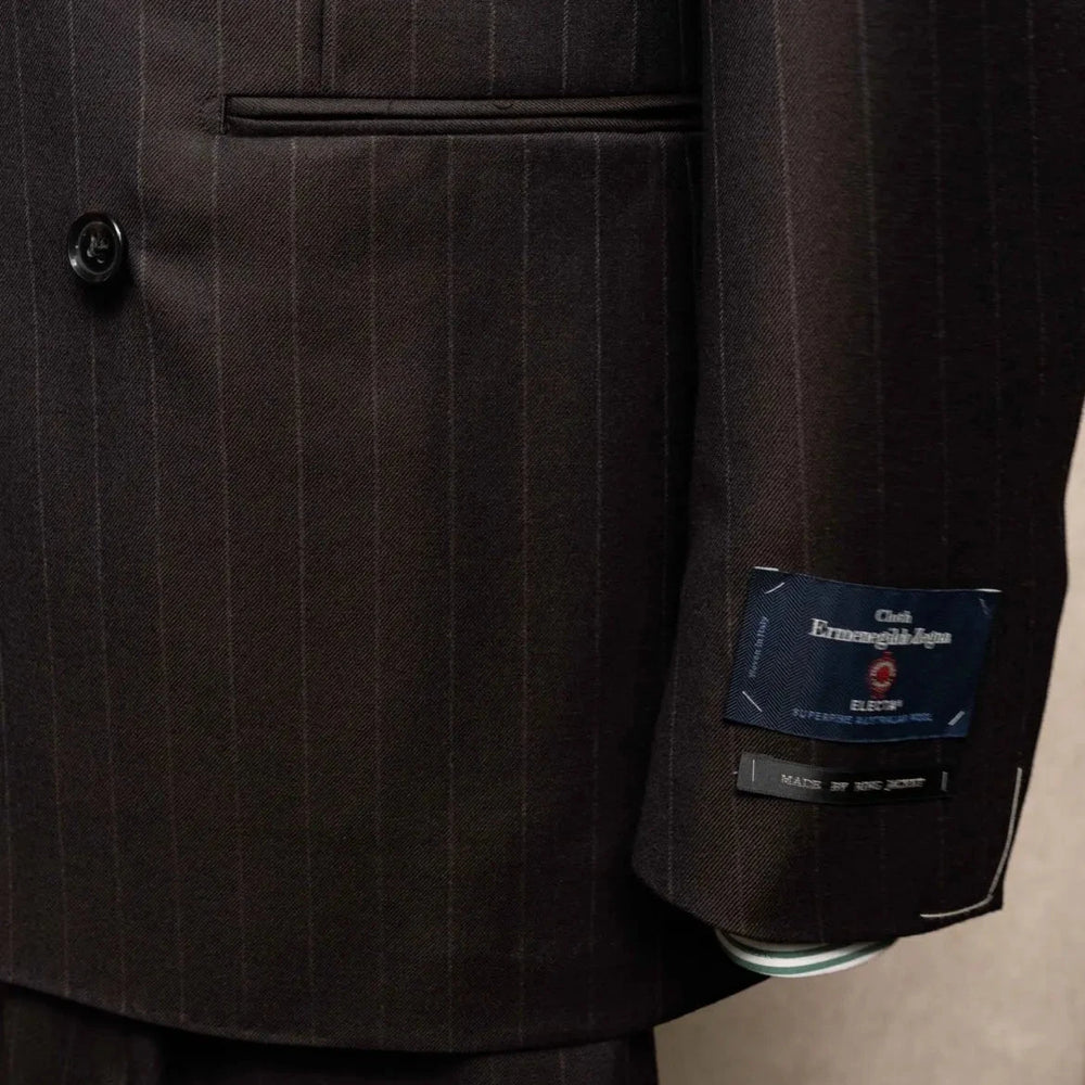 Close-up of the sleeve and hem area showing sleeve buttons, stitching, and clean finishing on the RMJ-04 Chalk Stripe Dark Brown Jacket.