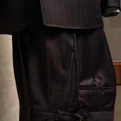 Front view of the trousers from the RMJ-04 Chalk Stripe Dark Brown Suit showing the pleats, clean leg line, and refined dark brown chalk stripe.