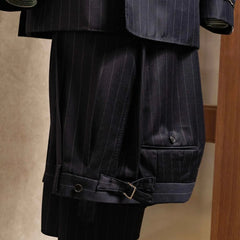 Front view of the trousers from the RMJ-04 Chalk Stripe Navy Suit showing pleats, tailored leg line, and refined chalk stripe wool by Zegna Electa.