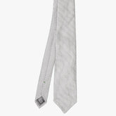 Front view of the Refinement dot neck tie in grey featuring a classic small dot pattern.