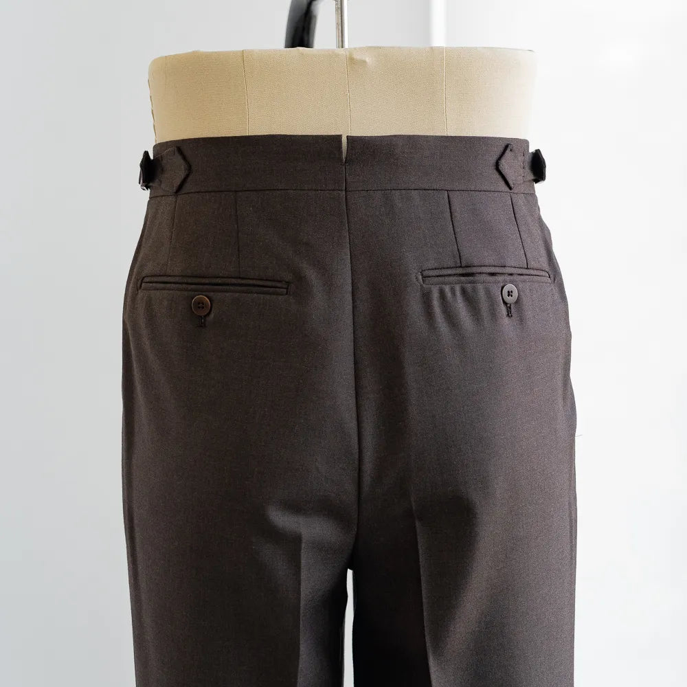 Back view highlighting the welt pockets, rear shaping, and structured brown Crispaire weave.