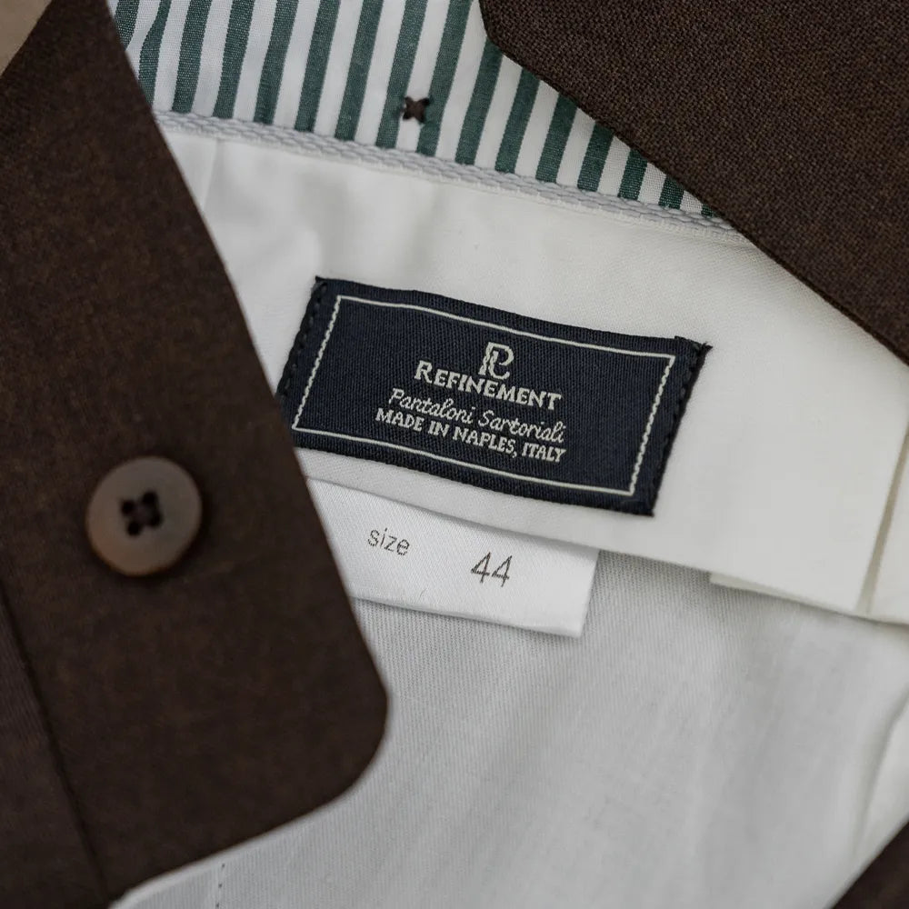 Close-up of the Refinement x Crispaire label showing interior craftsmanship.