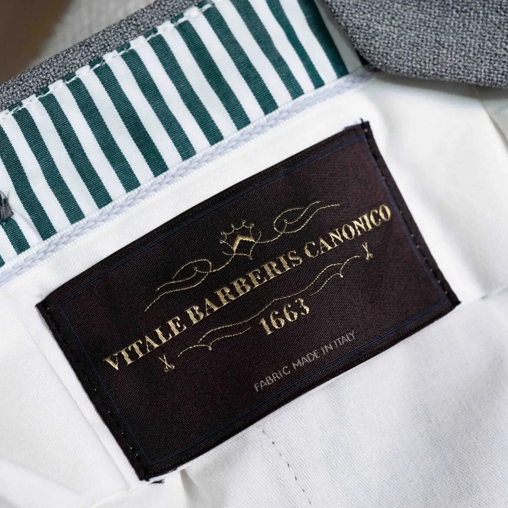 Close-up of the interior label showing Refinement branding and Drapers fabric marking.
