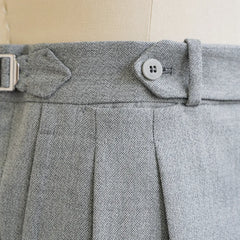 Side view showing the tailored leg line, straight fall, and crisp silhouette of the light grey wool.