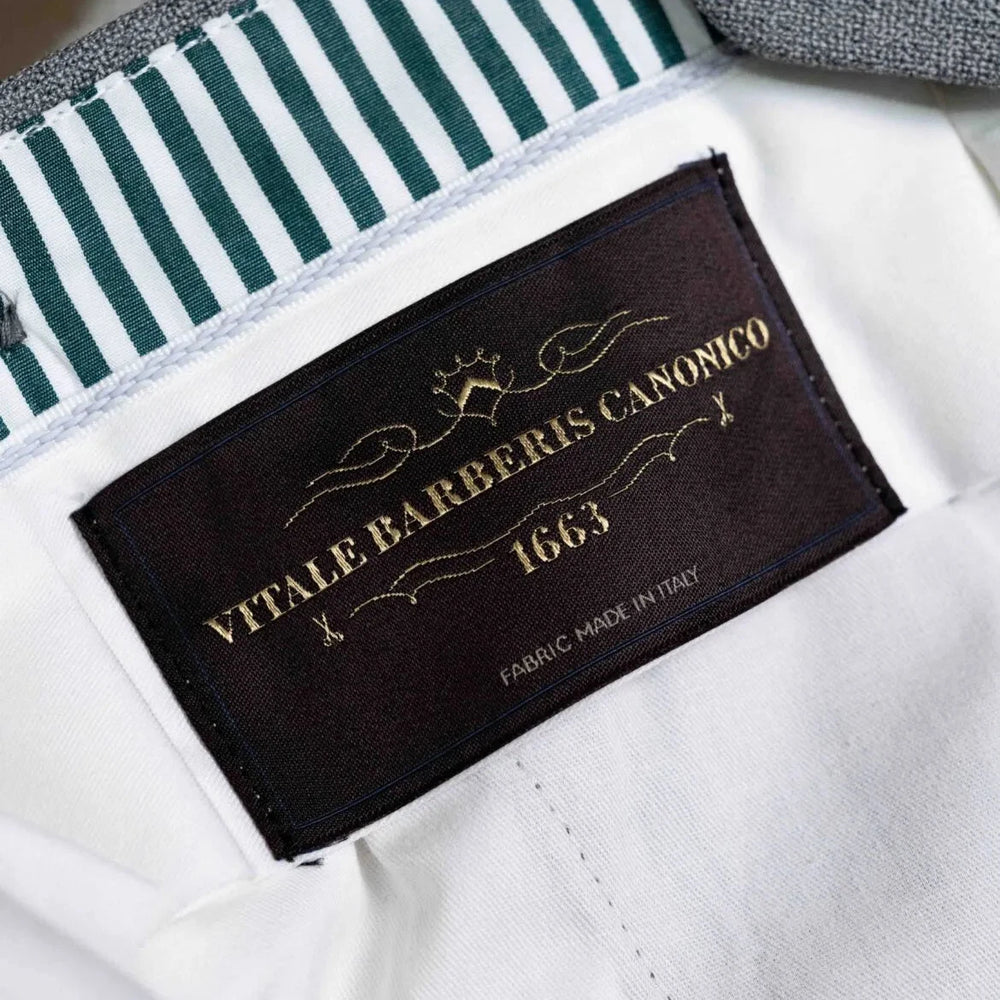 Close-up of the interior label showing Refinement branding and Drapers cloth identification.