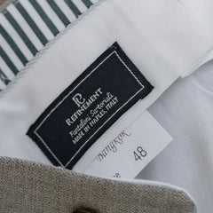 Close-up of the interior Refinement x Drapers label on the Pantaloni Sartoriali New Oatmeal trousers, showing branding, woven detailing, and clean internal finishing.