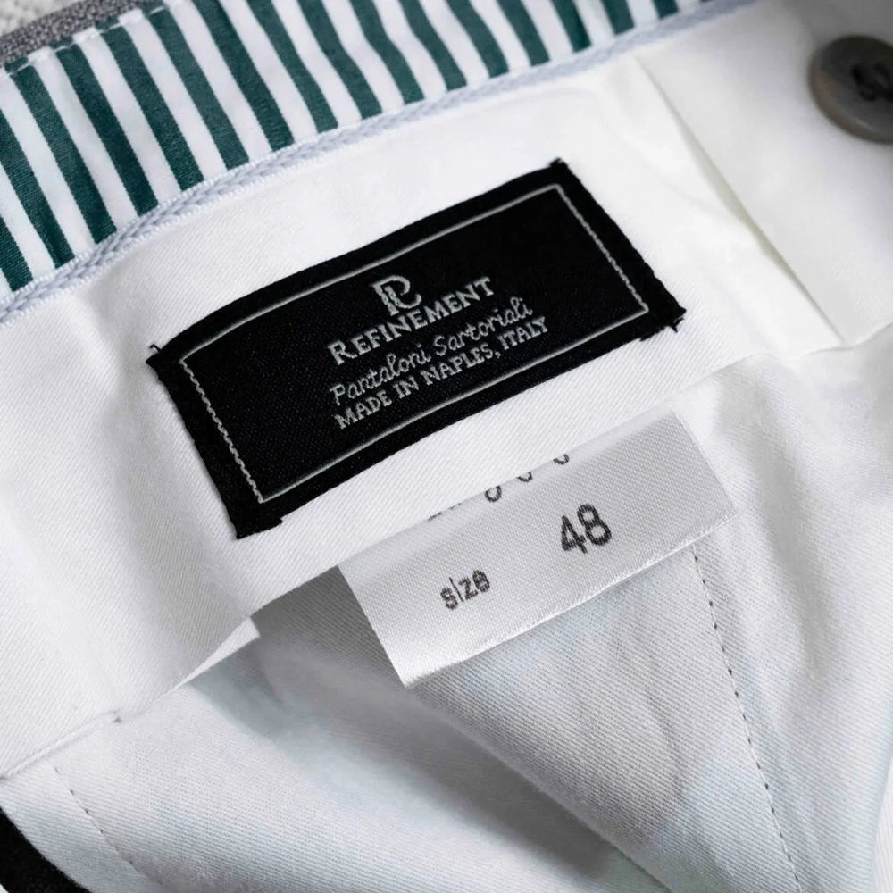 Close-up of the interior label showing Refinement and Drapers branding with clean inner finishing.