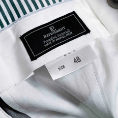Close-up of the interior label showing Refinement branding and Drapers cloth identification.