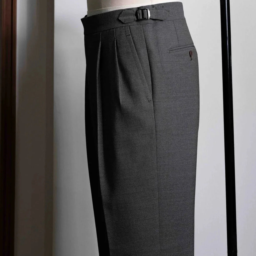 Side view showing the leg shape, side seam, and natural movement of the taupe-brown wool.