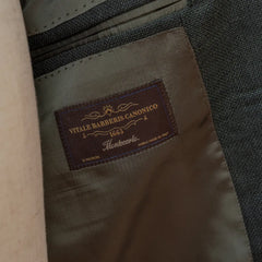 Close-up of the internal label of the RMJ-03 Jacket Green by VBC showing the Refinement × Ring Jacket branding and inner lining construction.