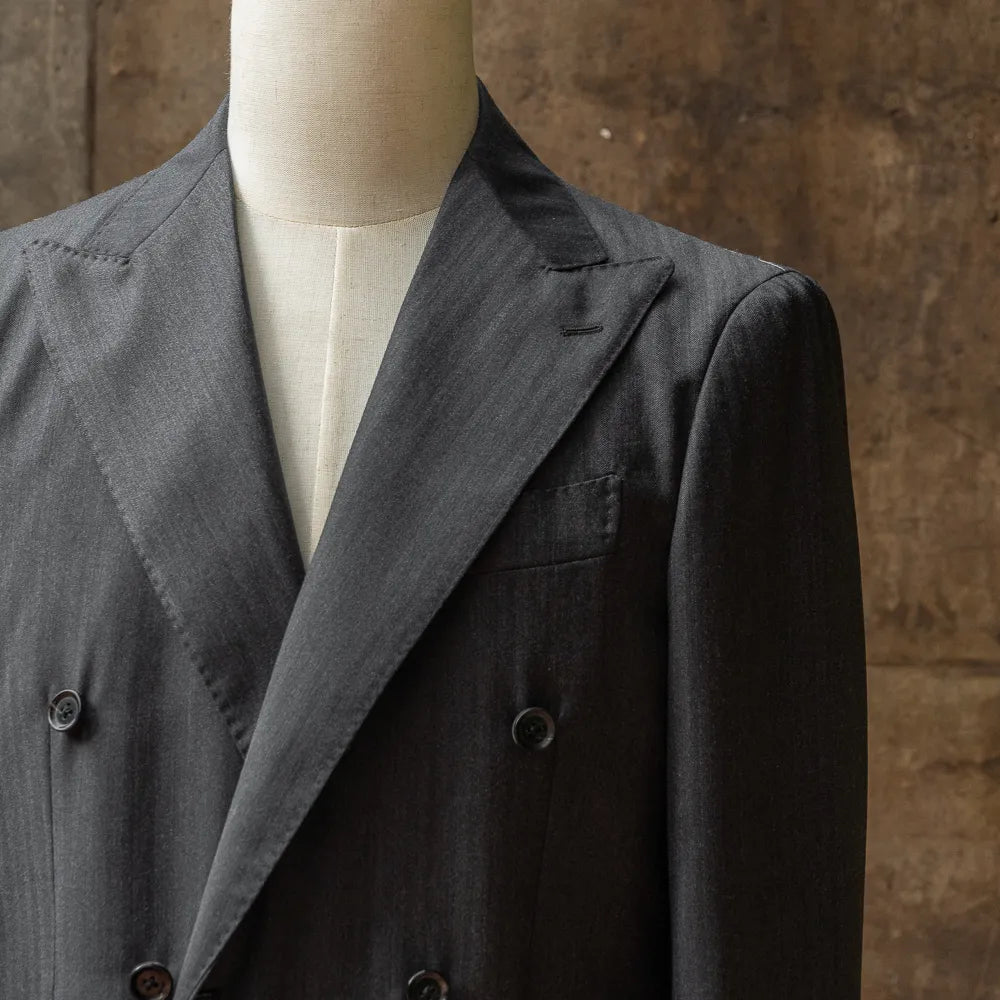 Close-up of the peak lapel on the RMJ-04 Double Breasted Chalkstripe Jacket showing the lapel roll, sharp peak shape, and VBC chalkstripe wool texture.