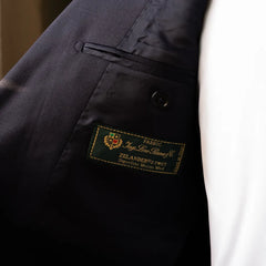 Interior close-up of the Loro Piana Zelander label showcasing wool origin and premium quality.