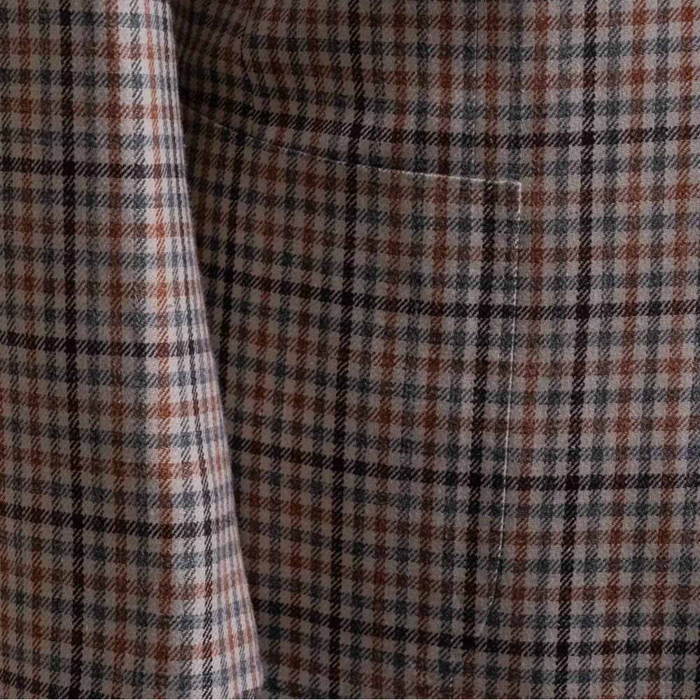 Close-up of the front pockets showing flap construction, stitching accuracy, and pattern alignment.