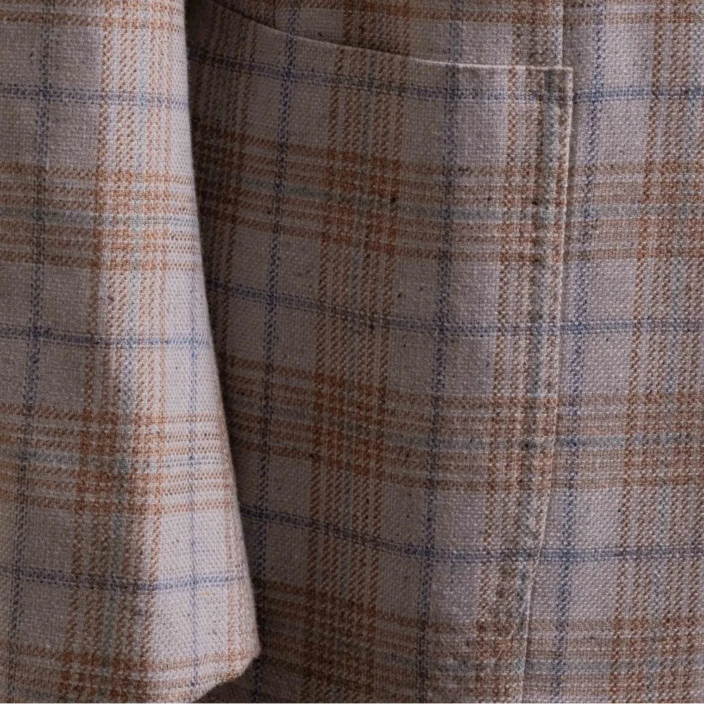 Close-up of the front pockets showing flap design, stitching accuracy, and perfect pattern matching.