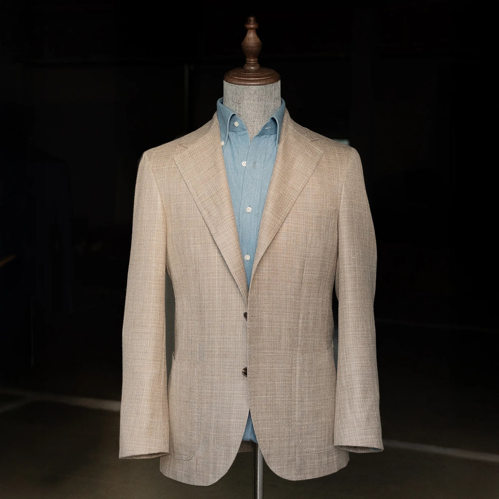 Front view of the Refinement Tailoring Rfmt-01 Sport Jacket Summertime Beige by Loro Piana on mannequin, showing the soft shoulders, notch lapels, and lightweight beige Summertime fabric.