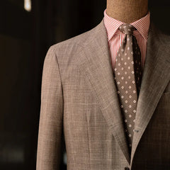 Close-up of the chest area highlighting the lapel roll, pocket placement, and textured brown Summertime weave.