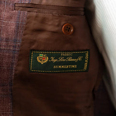 Interior close-up of the Loro Piana Summertime label, showing cloth origin and premium finishing.