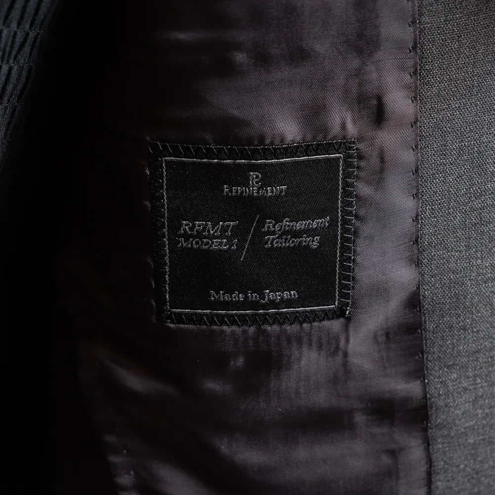 Close-up of the Refinement Tailoring interior label and lining construction.