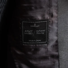 Close-up of the Refinement Tailoring interior label and lining construction.