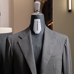 Close-up of the lapel and chest showing refined tailoring and clean lapel roll.