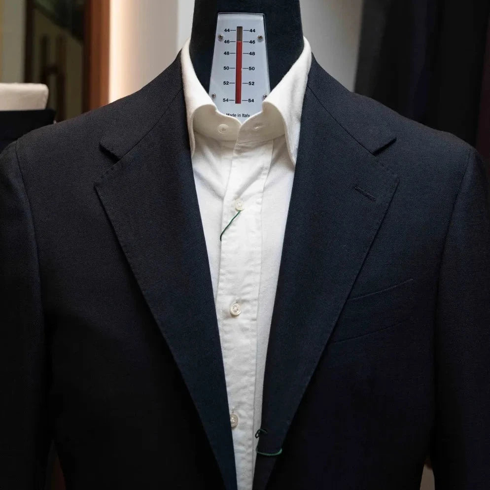 Front view of the Rfmt-01 jacket showing notch lapels, two-button closure, and structured silhouette.