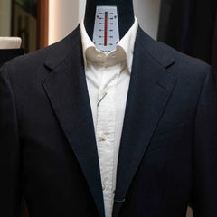 Front view of the Rfmt-01 jacket showing notch lapels, two-button closure, and structured silhouette.