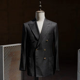 Full front view of the Refinement Tailoring Rfmt-02 double breasted sport jacket in black by Loro Piana showing structured silhouette and peak lapels.