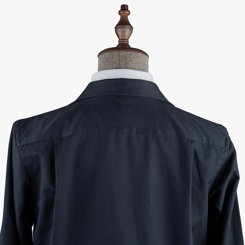 Back view highlighting the smooth navy fabric, clean back panel, and refined Shirt Blouson construction.