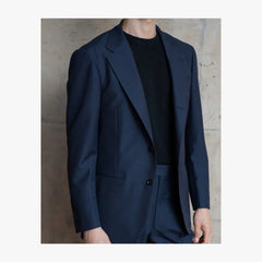 Close-up detail of RMJ-03 navy single breasted suit by Ring Jacket showing Doemueil fabric texture