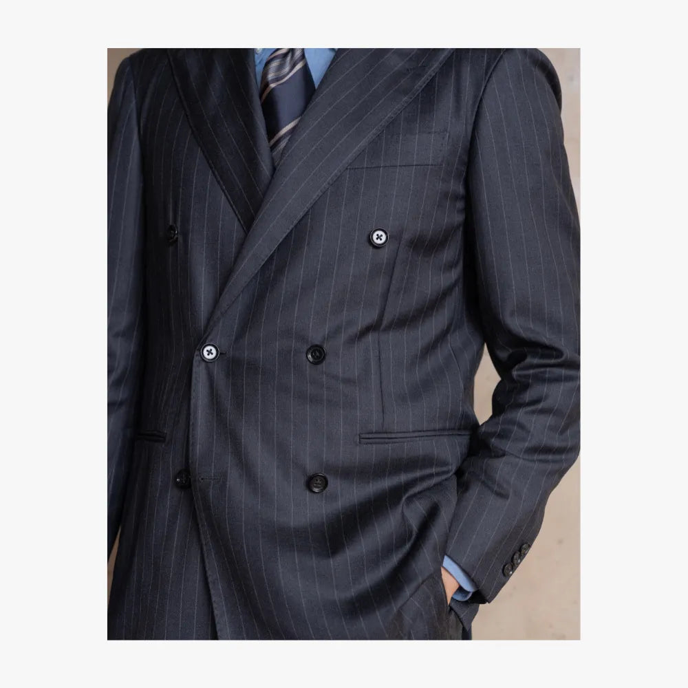 Close-up detail of RMJ-04 charcoal grey chalkstripe double breasted suit by Ring Jacket showing chalkstripe pattern