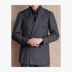 Close-up detail of RMJ-04 charcoal grey double-breasted suit by Ring Jacket showing VBC herringbone texture