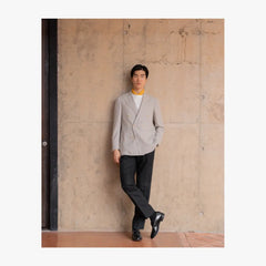 Full body view of RMJ-04 ivory double breasted jacket by Ring Jacket made with VBC hopsack fabric