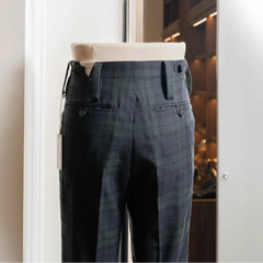 Side profile of the Tangent Tan 25° Wool Check Black Watch trousers highlighting the wool texture and clean drape.