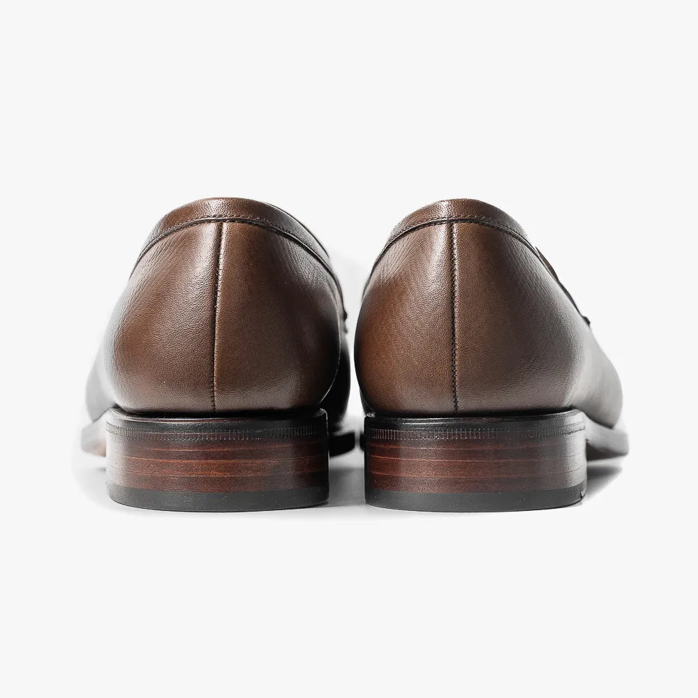 Close-up of the leather sole showing clean edge finishing and solid construction.