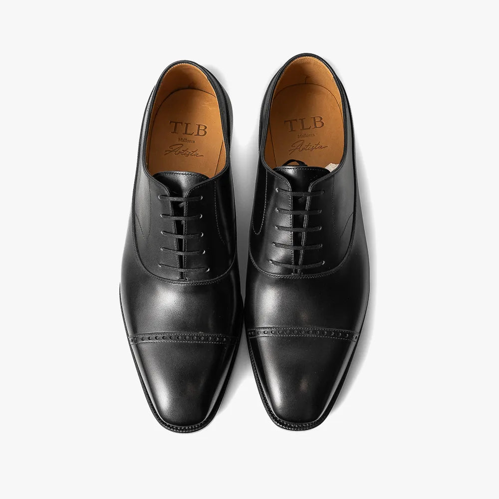 Full view of the TLB Mallorca Artista 109 Picasso in black box calf showing the elegant silhouette and refined dress shoe profile.
