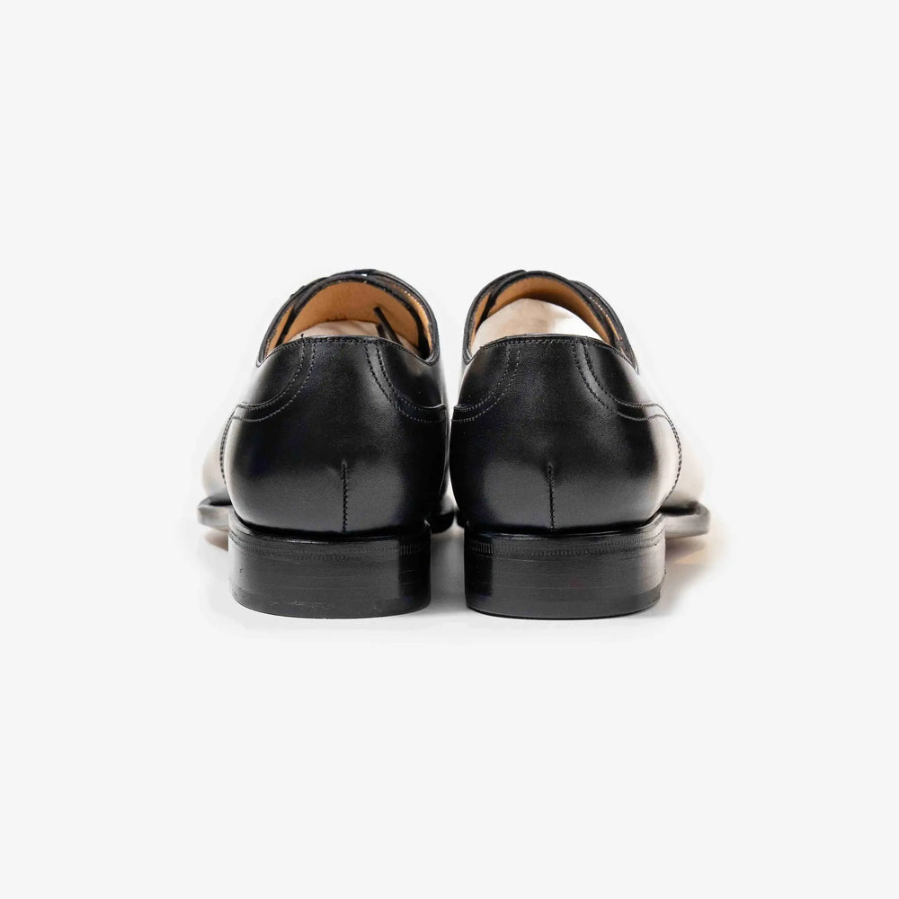 rear view of TLB Mallorca Artista 135 Velazquez Black Box Calf with stacked leather heel