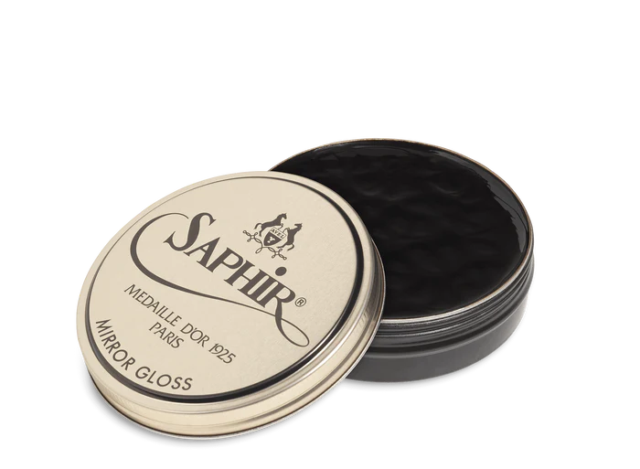 Front view of Saphir Mirror Gloss showing the iconic round metal tin and classic navy-and-gold label.
