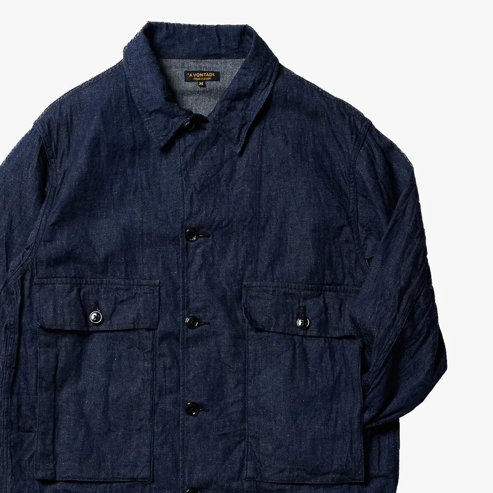 Close-up of the indigo fabric showing weave texture, depth of color, and durable utilitarian character.
