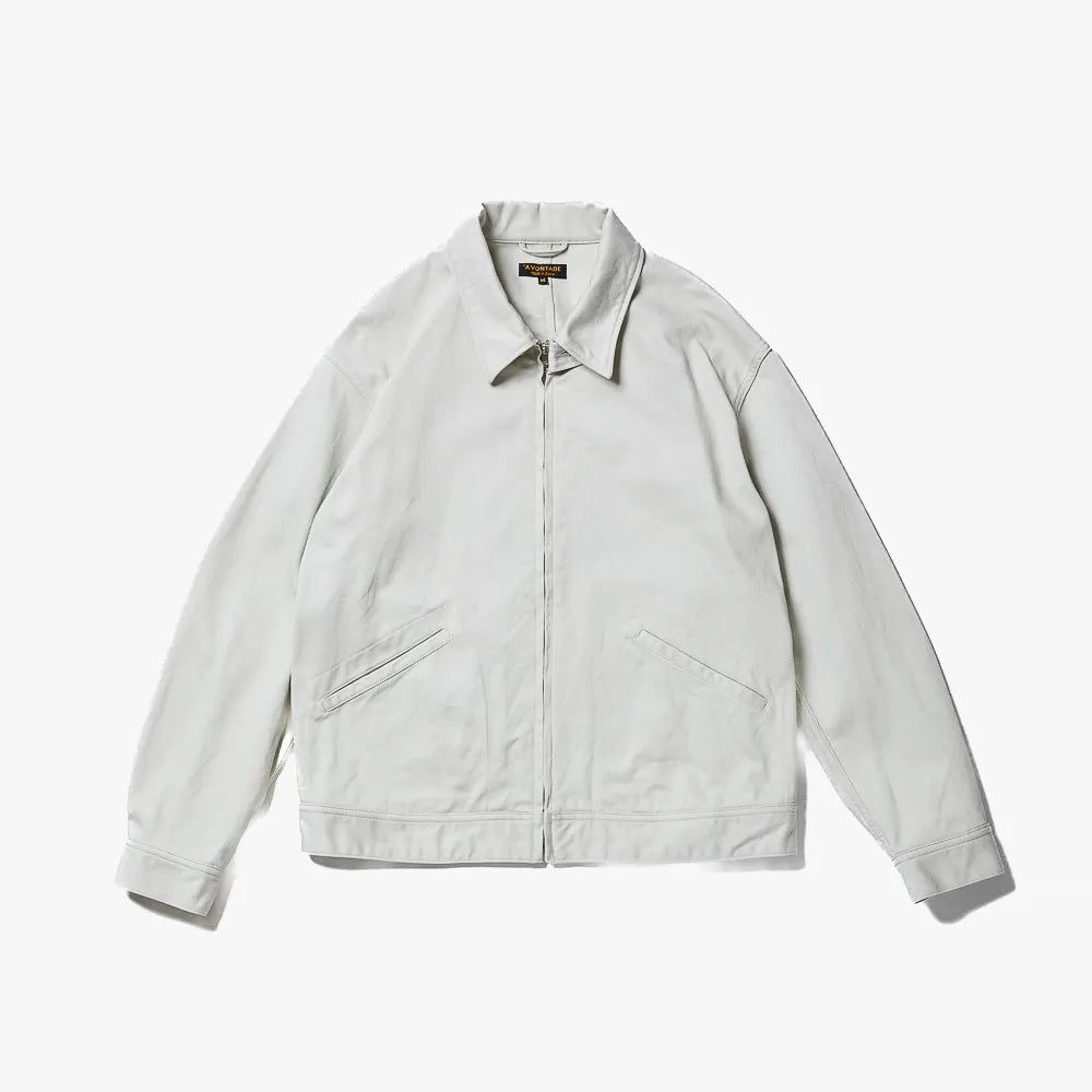 Front view of the A Vontade Zip Work Jacket in vintage pique ivory showing the zip-front closure, workwear silhouette, and textured pique fabric.