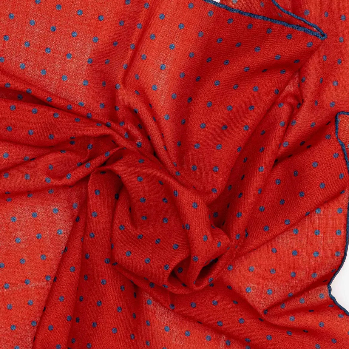 Close-up detail of the Adamley Bandana Small Poka Orange